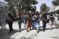 Taliban fighters patrol in the Wazir Akbar Khan neighborhood in the city of Kabul, Afghanistan