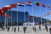 flags of NATO member countries flutter during a NATO summit in Brussels