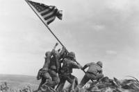 U.S. Marines raise an American flag atop Mt. Suribachi, Iwo Jima