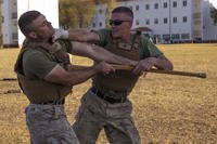 Marine blocks a bayonet trainer and chokes his opponent.