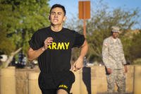 Army Reserve Spc. Julian Ditona, a multi-channel transmission systems operator/maintainer, assigned to the 98th Expeditionary Signal Battalion, 335th Signal Command (Theater), sprints to the finish line of a two-mile run during the Army physical fitness test at Fort Huachuca, Arizona, March 27, 2017. (Sgt. 1st Class Brent C. Powell/U.S. Army Reserve photo) Reservist sprints to finish of run during the Army physical fitness test.