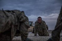 Soldiers complete exercises during physical training.