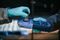 An airmen conducts a water test at Pearl Harbor, Hawaii