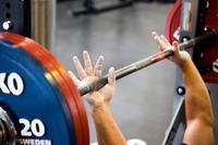 A competitor gets ready to perform a bench press.