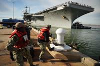 Sailors man the rails of USS Harry S. Truman