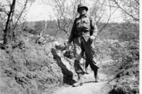 U.S. Marine Brig. Gen. Lewis B. &quot;Chesty&quot; Puller strides along a narrow trail in the battle area during the Korean War on May 12, 1951.