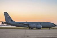 Airmen tow a KC-135 Stratotanker.