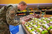A U.S. Air Force airman shops for produce at Ramstein Air Base.