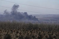 Smoke billows during fighting between Ukrainian and Russian forces in Soledar, Donetsk region