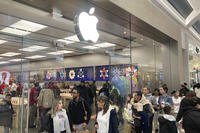 People shop at an Apple store in the Westfield Garden State Plaza shopping mall in Paramus, New Jersey.
