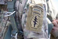 Green Beret, assigned to 20th Special Forces Group, Alabama National Guard, displays his Unit patch and tabs