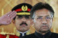 Pakistan's President Pervez Musharraf listens to the national anthem.