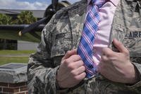 Your military uniform isn’t considered approproate for a job interview; instead, a shirt and tie would be more appropriate.