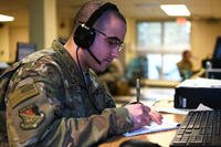Staff Sgt. Walter Ramos, crew chief, 157th Air Refueling Wing, New Hampshire Air National Guard, fields calls for unemployment benefits.