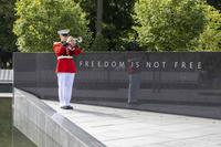 Marine bugler participates in the Korean War Veterans Memorial Wall of Remembrance Dedication Ceremony