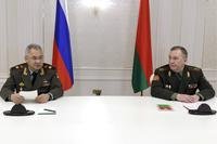 Russian Defense Minister Sergei Shoigu, left, and Belarusian Defense Minister Viktor Khrenin