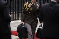 Military aide carries the Presidential Emergency Satchel, known as the "nuclear football" 