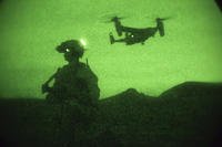 A U.S. Marine provides security at the extraction point while conducting night-raid operations training on Camp Pendleton, Calif.