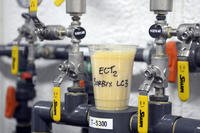 A cup full of single-use, ion-exchange, gel-based media sits atop valves that control a ground water remediation system being used to remediate polyfluoroalkyl substances (PFAS) from groundwater at the fire training area of Wright-Patterson Air Force Base, Ohio.