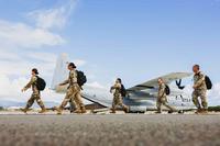 Hawaii National Guardsmen  prepare to board a KC-130J Hercules