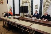 Russian President Vladimir Putin, left, meets with Russian Deputy Defense Minister Yunus-Bek Yevkurov
