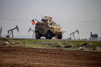 A U.S. military vehicle on a patrol in the countryside near the town of Qamishli, Syria
