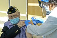 U.S. Army veteran receives shot of the Pfizer COVID-19 vaccination