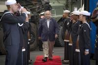 Sailors aboard the USS Mesa Verde render honors to Secretary of the Navy Carlos Del Toro 