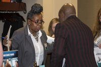 An Air Force Materiel Command management analyst assists a candidate during the Air Force Civilian Service hiring event at the Holiday Inn in Fairborn, Ohio.