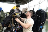 A Belgian military diver is getting ready to dive under the Danube River in Budapest, Hungary