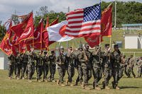 U.S. Marines conduct a pass and review during a relief and appointment ceremony on Marine Corps Base Camp Butler in Okinawa, Japan.