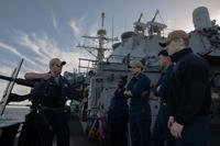 Chief Gunner’s Mate Scottin Platero, left, briefs sailors during a weapons familiarization course aboard the Arleigh Burke-class guided-missile destroyer USS Laboon (DDG 58) in the Mediterranean Sea.