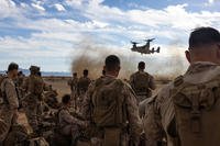 U.S. Marines prepare to board an MV-22B Osprey during a mission rehearsal exercise at Marine Corps Air Station Yuma