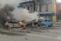 firefighters extinguish burning cars after shelling in Belgorod, Russia