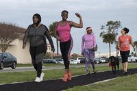Participants show their moxie during the ‘Walk a Mile in Her Shoes’ event at MacDill Air Force Base, Fla.