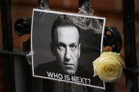 flower and a picture are left as a tribute to Russian politician Alexei Navalny