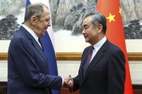 Russian Foreign Minister Sergey Lavrov, left, and Chinese Foreign Minister Wang Yi