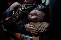 A Palestinian woman mourns her child.