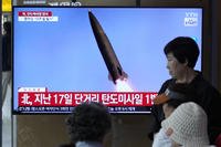 A news program broadcasts a file image of a missile launch by North Korea, at the Seoul Railway Station in Seoul