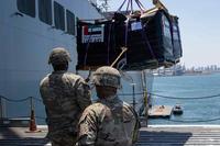 Soldier load humanitarian aid bound for Gaza