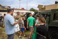 U.S. Army Spc. Justin Suppes, a cavalry scout with the 1st Combat Brigade Combat Team, gave a tour of the joint light tactical vehicle at the Kansas state fairgrounds in Hutchinson, Kansas.
