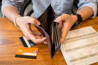 credit card debt - holding an empty wallet