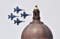 Jets fly past the Naval Academy Chapel dome.