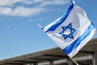 Israeli flag flies during a protest