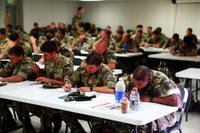 Royal Marines and Dutch Marines take notes during a Humvee and 7-ton maintenance course aboard Marine Air Ground Combat Center Twentynine Palms,