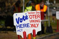 Signs direct voters to a ballot drop-off location in Denver.