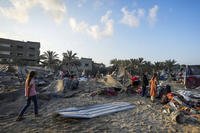 destruction after an Israeli airstrike on a crowded tent camp housing Palestinians displaced by the war in Muwasi, Gaza Strip