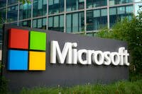 The Microsoft logo is displayed outside its French headquarters