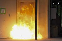 A U.S. special forces soldier sets off a traditional explosive charge that's noticeably larger than recently-developed breaching charges