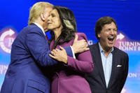 Tulsi Gabbard hugs Donald Trump